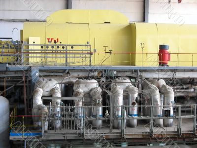 Steam turbine at a power plant with tubes and machinery