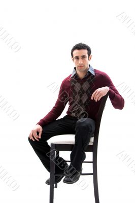 Handsome guy sitting on chair