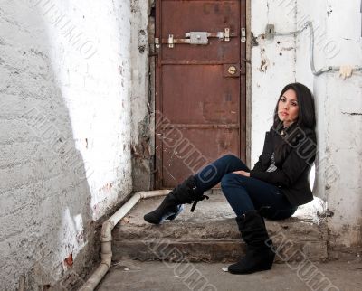 Girl sitting in basement