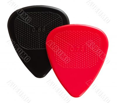 two ribbed guitar plectrums