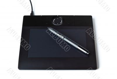 black drawing tablet with pen