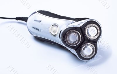 electric shaver on grey background