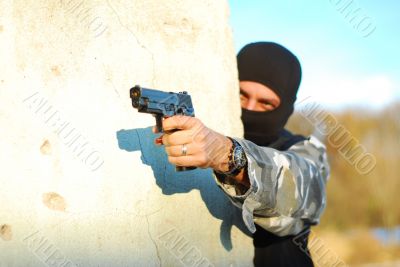 terrorist with mask and gun