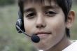 Young boy with phone headset