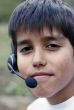 Young boy with phone headset