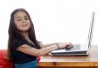 Young girl in front of a laptop