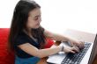 Young girl in front of a laptop