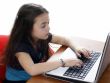 Young girl in front of a laptop