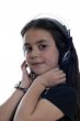 Young girl with headphones smiling at camera