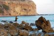 Fishing on a Rocky Beach