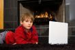 Boy at Fireplace on Computer