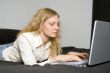 Woman on Bed with Laptop.