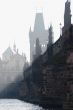 Charles bridge in the early morning fog