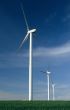 Three windturbines on blue sky