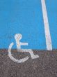 Logo on asphalt for disabled persons