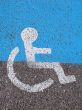 Logo on asphalt for disabled persons