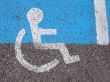 Logo on asphalt for disabled persons