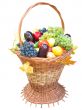 wooden basket with autumn harvest fruit vegetables and leaves isolated