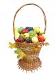 wooden basket with autumn harvest fruit vegetables and leaves isolated