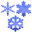 set of blue, glass effect snow flakes over white