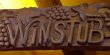 Wood sign of a winstub, winebar in Alsace