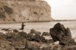 Fishing on a Rocky Beach sepia