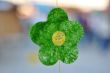 green textile flower