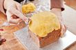 Decorating christmas cake with spoon