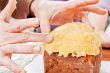 Hands decorating christmas cake closeup